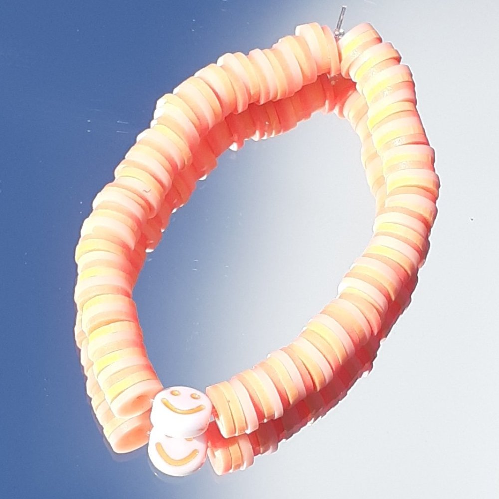 Clay bead stretchy string bracelet When you buy 2 you get 1 free bracelet!